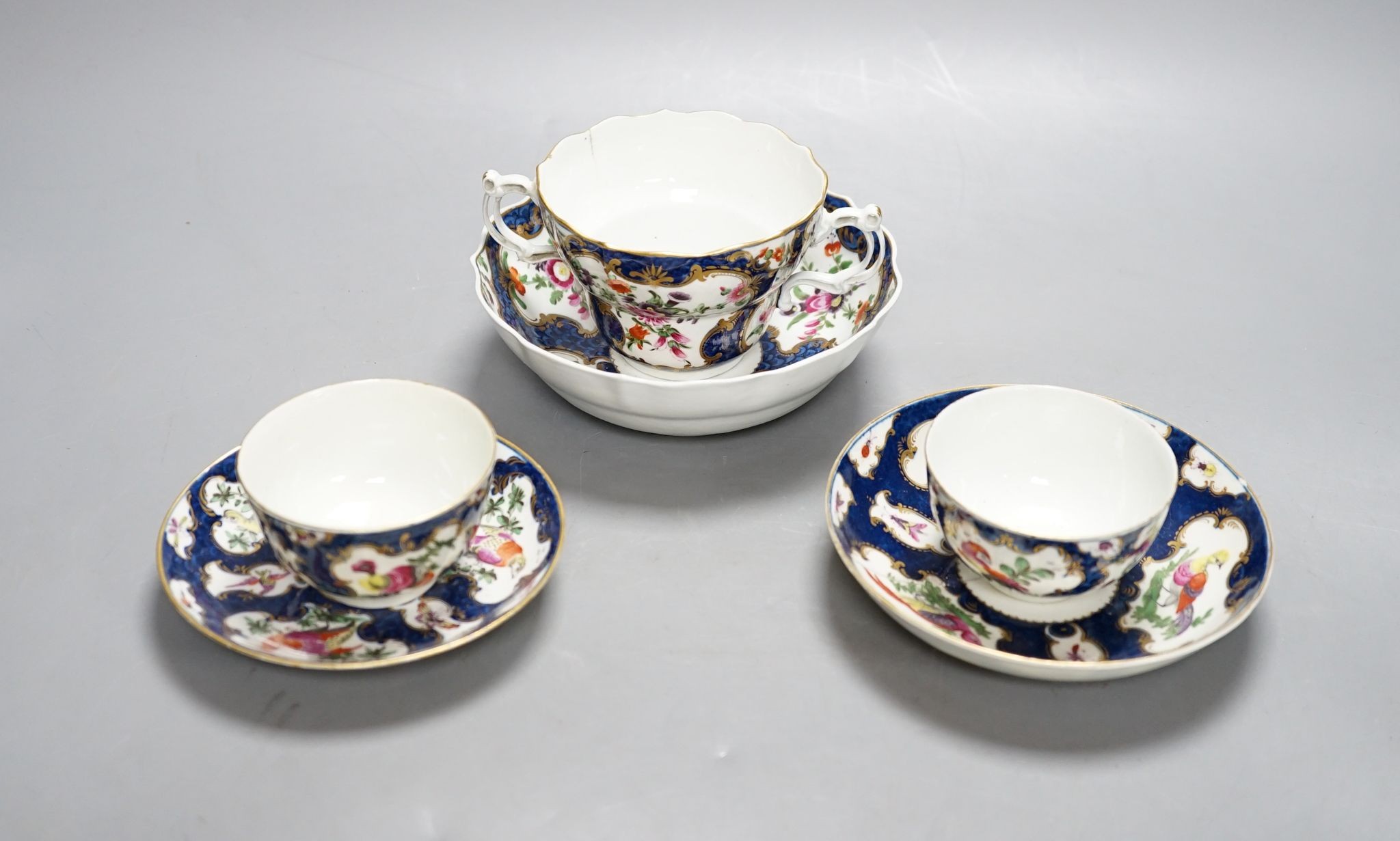 A Worcester scale blue chocolate cup and saucer and a pair of similar tea bowls and saucers, circa 1775